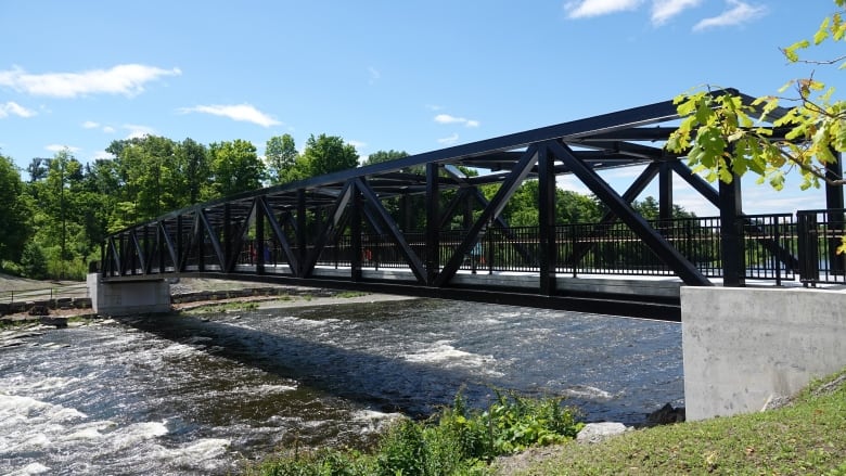 A footbridge over a river.