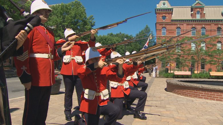 A ceremonial guard demonstration gets underway outside Fredericton city hall.