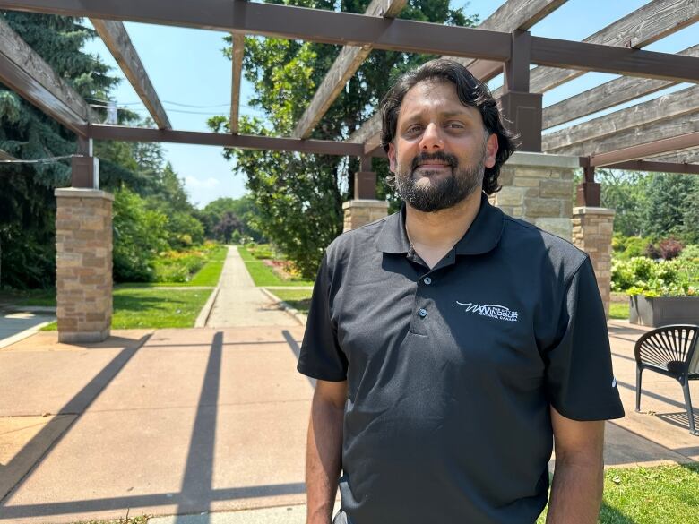 A man stands in a park.