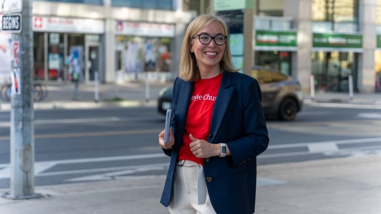 Leslie Church, the Liberal candidate in the upcoming Toronto-St. Paul's federal byelection, greets voters outside a transit stop in the city's midtown.