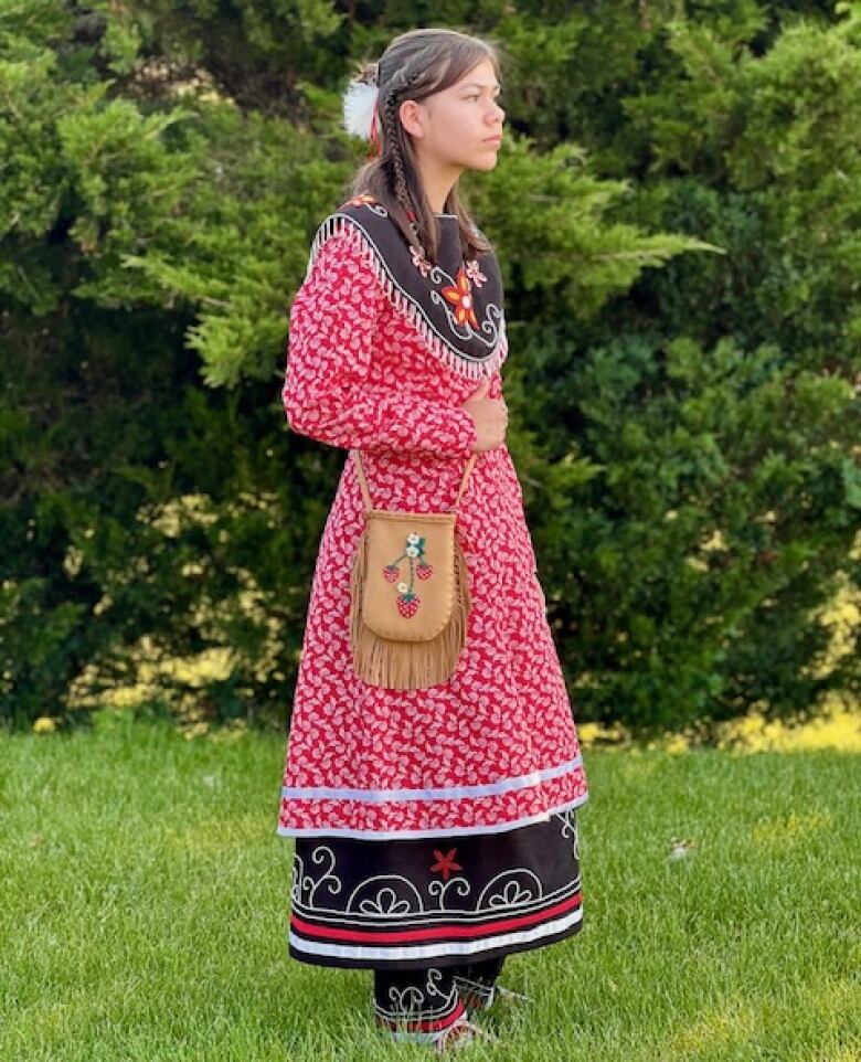 Kanien'keh:ka girl in traditional Haudenosaunee outfit.