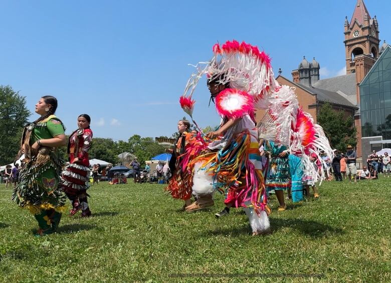 People dance at an Indigenous Solidarity Day event at London's Wortley Village Green.