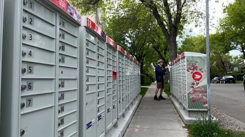 Mailboxes line the sidewalk outside the Canada Post office in Didsbury, Alta.