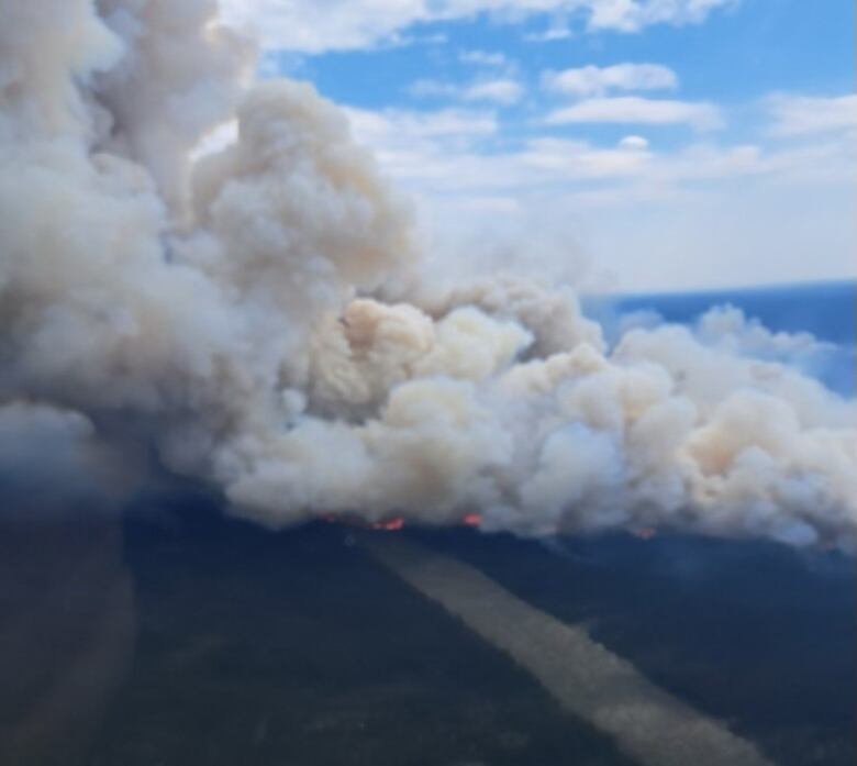 Areal image of ground covered in smoke.