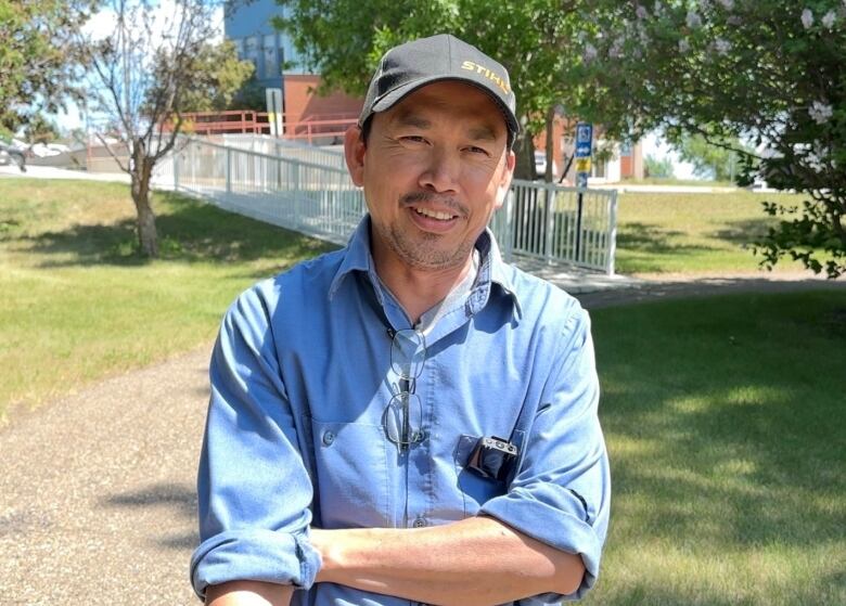 A man wearing a hat is pictured.