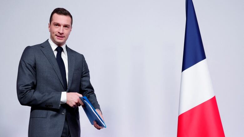 Jordan Bardella, president of the French far-right  Rassemblement National (RN) party, arrives to attend a press conference in Paris on Monday to present policy priorities as part of the campaign for the upcoming French parliamentary elections.