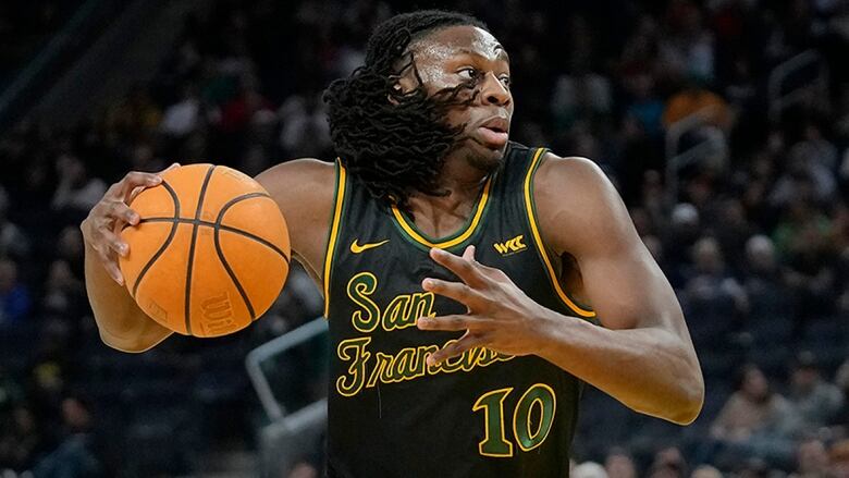 San Francisco forward Jonathan Mogbo drives the net during an NCAA college basketball game against Gonzaga on Feb. 29, 2024 in San Francisco, Calif.