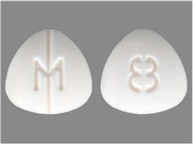 A white, three sided pill, labeled with an M and 8.