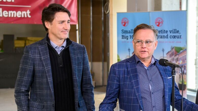 Wayne Long, MP for Saint John-Rothesay speaks as Prime Minister Justin Trudeau and Saint John Mayor Donna Reardon look on during a visit to The Wellington, a new inclusive housing project in Saint John, N.B. on Wednesday, Jan.17,2024. 