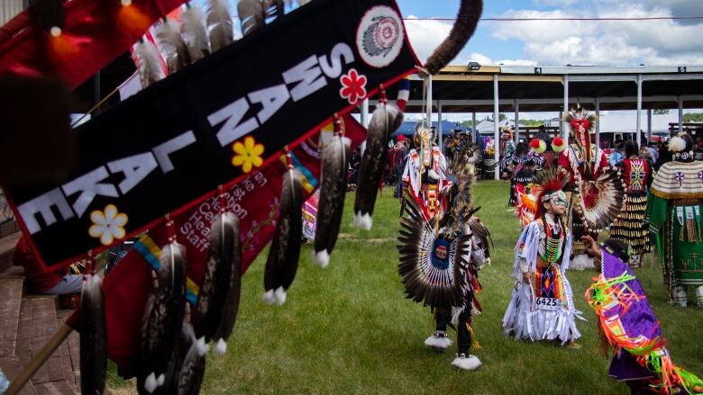 Dancers participate in an intertribal dance at a powwow.