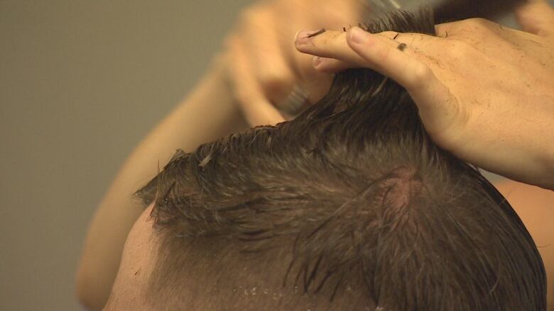 Closeup of a men's haircut.