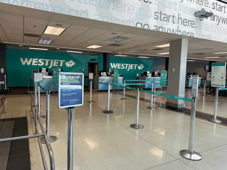 WestJet kiosks sat empty on Tuesday afternoon at the London, Ont., airport. More than 100,000 passengers across the country were impacted due to a surprise strike from the airline's mechanics over the Canada Day long weekend. 