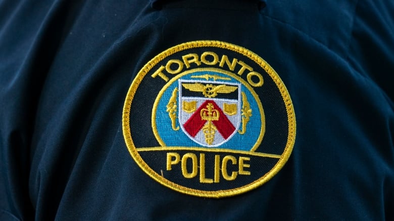 A Toronto Police Service logo patch is shown on an officer's uniform on Sept. 5, 2023.