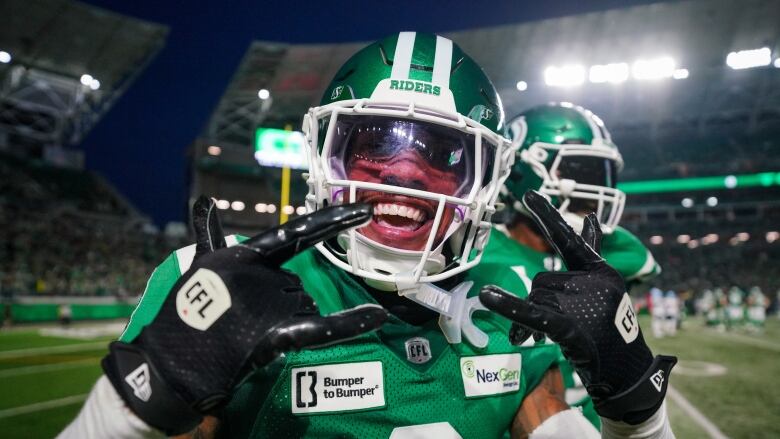  Saskatchewan Roughriders' Marcus Sayles (8) celebrates after running back an interception for a touchdown against the Toronto Argonauts during the second half of CFL football action in Regina, on Thursday, July 4, 2024. 