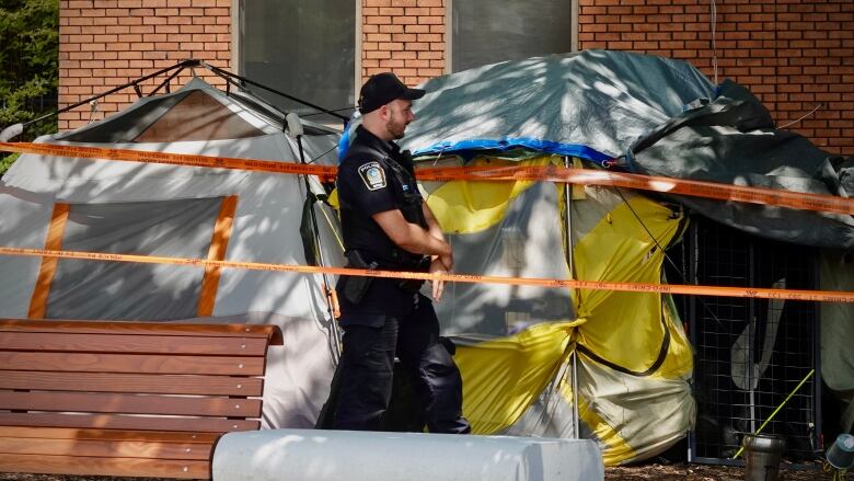 The body of the man was found in a 'makeshift shelter' between two buildings on Lo-Pariseau Street, near Jeanne-Mance Street, according to Montreal police. 