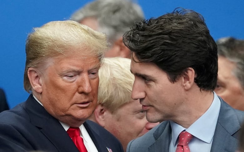 Trump looking down, Trudeau looking at him