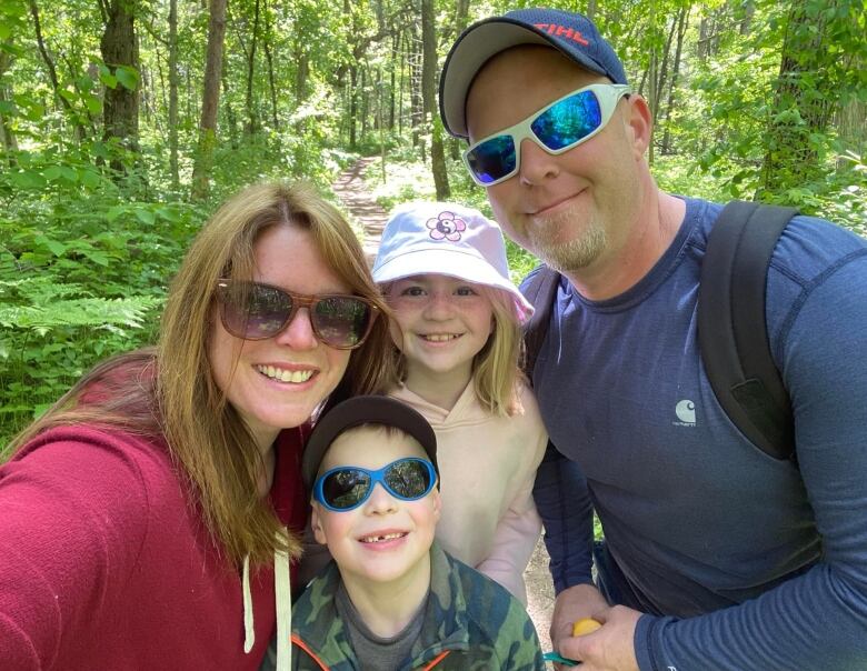 A family of four on a camping trip.