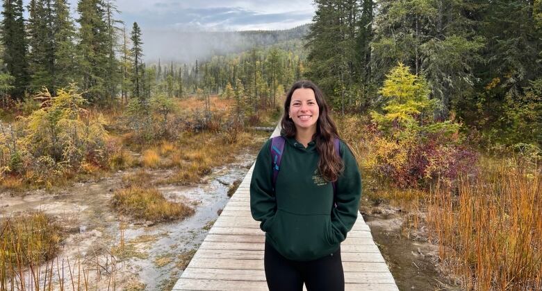 Zoe Share on a boardwalk in the fall