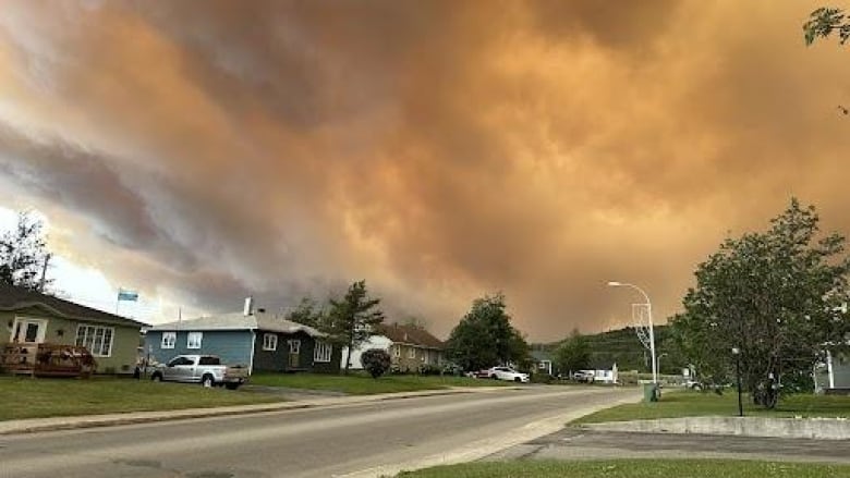 Sky full of smoke above residential area