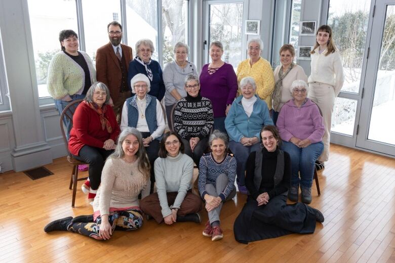 A group of women pose for a photo