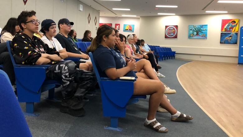 Several Mi'kmaw high school students are shown seated in an auditorium at a culinary camp.