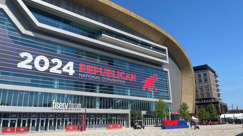 A large arena is affixed with a sign for the Republican National Convention.