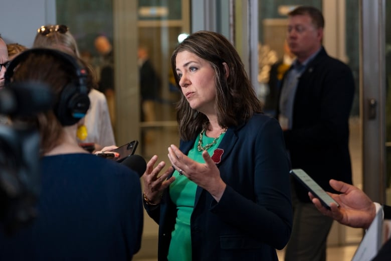 Alberta Premier Danielle Smith speaks with reporters before a meeting between Canada's premiers and Indigenous leaders at the Council of the Federation meetings in Halifax on Monday, July 15, 2024.