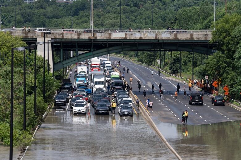 Drivers are stranded due to flood waters blocking the Don Valley Parkway.