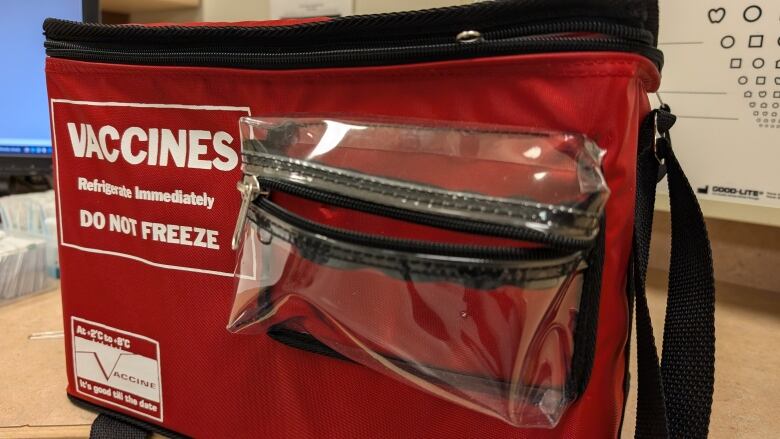 A vaccine bag sitting on a table.