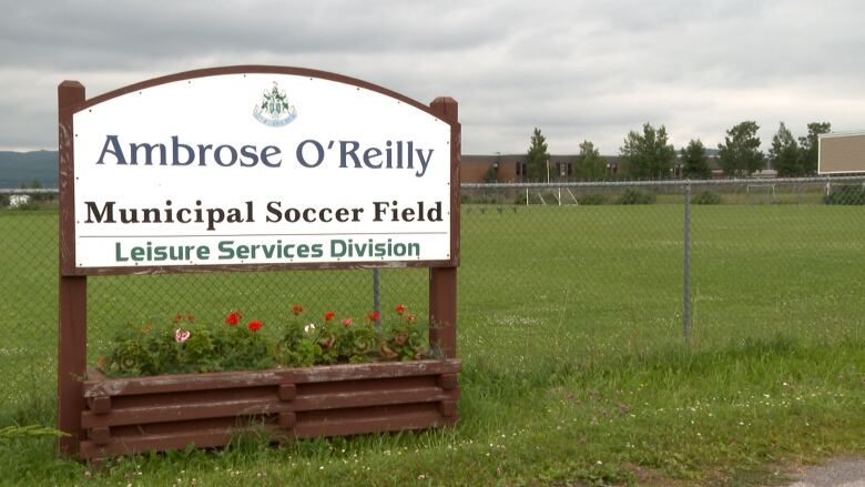 A sign in front of a fenced-off field says 'Ambrose O'Reilly Municipal Soccer Field.'