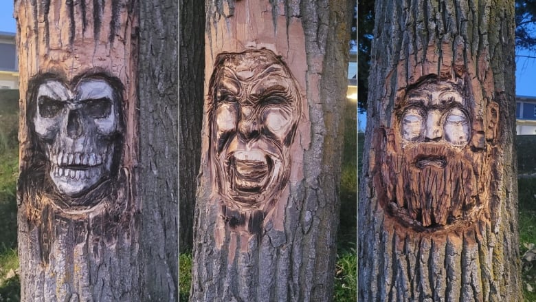 faces carved into tree trunks