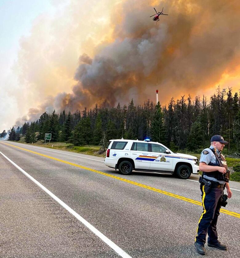 A helicopter against smoke.