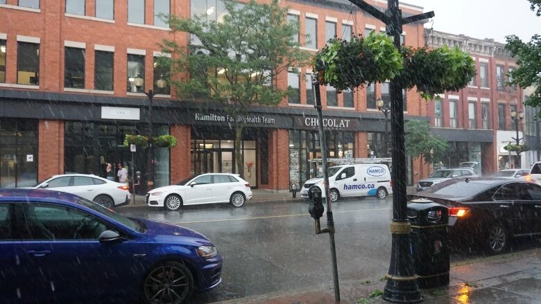 A street under heavy rain. 