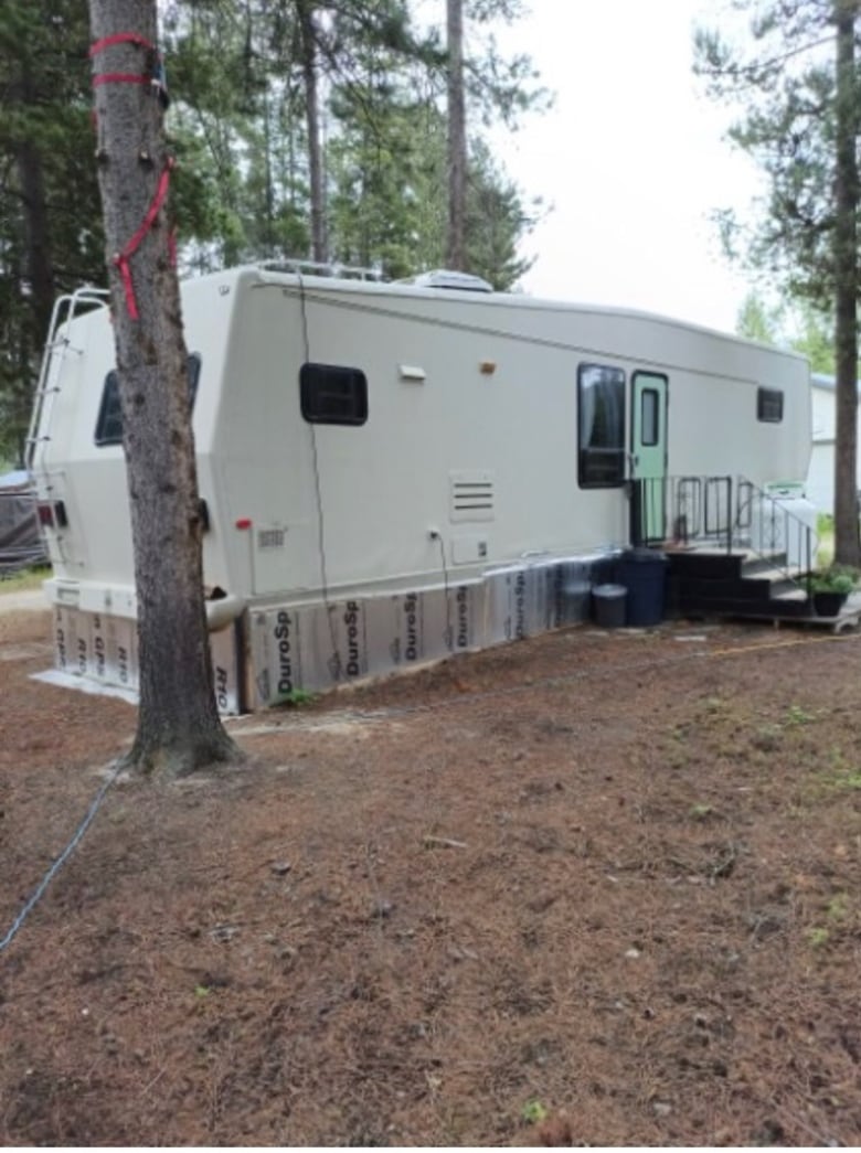 an RV among trees