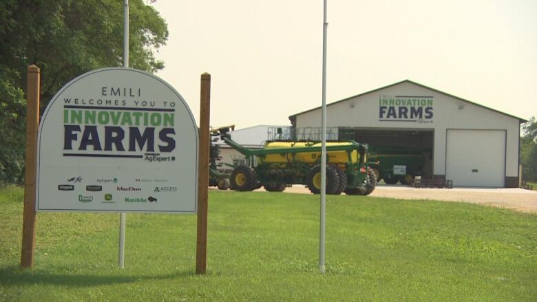 Innovation Farms headquarters signage in front of a warehouse in Grosse Isle, Man.