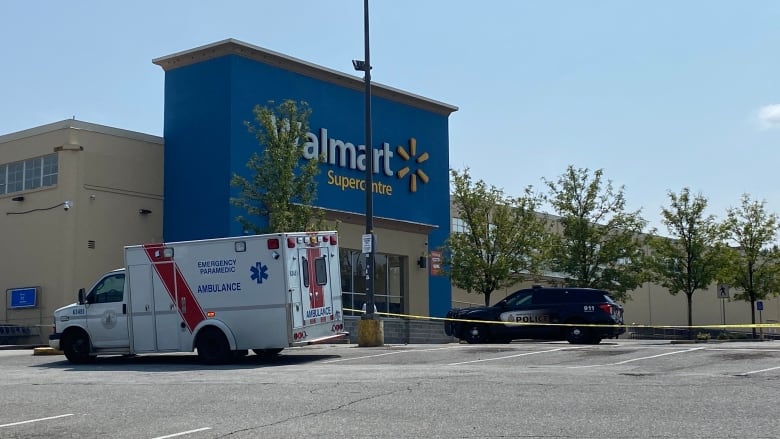 An ambulance parked outside a Walmart store