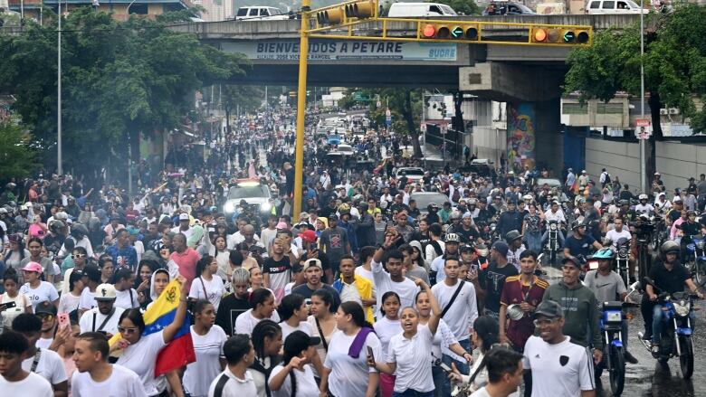 Opponents of Venezuelan President Nicolas Maduro's government are seen protesting in Caracas on  Monday, July 29, 2024.