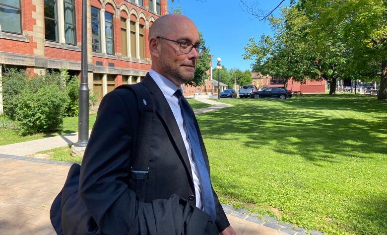 Scott Morrison walks away from the Fredericton courthouse.