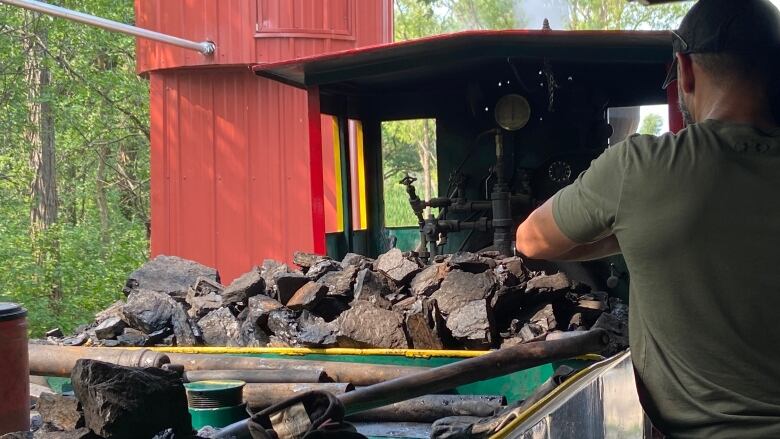 A pile of coal on a steam train.