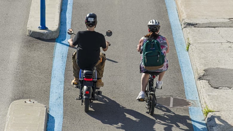 two people on electric vehicles