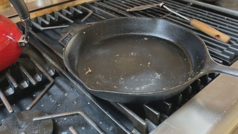 A frying pan with some residual food