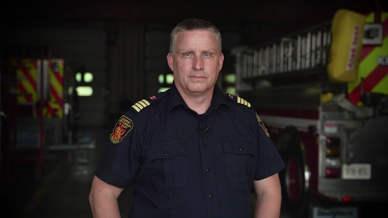 Deputy Fire Chief standing in fire hall