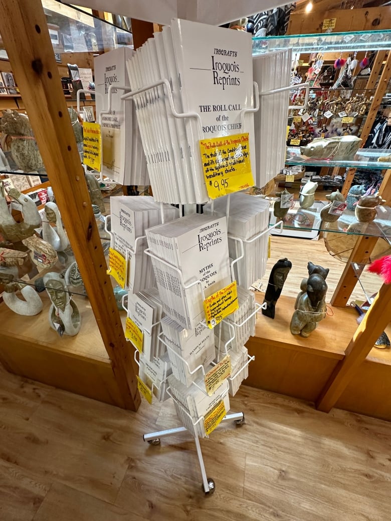 A product rack in a shop holds publications for sale. 