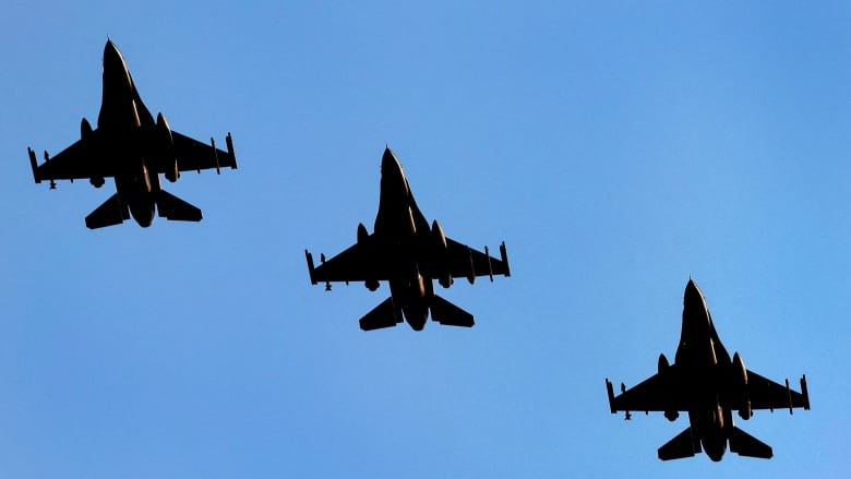 A file photo shows a group of Dutch F-16 fighter jets flying above an air base in Volkel, Netherlands, on June 9, 2023.