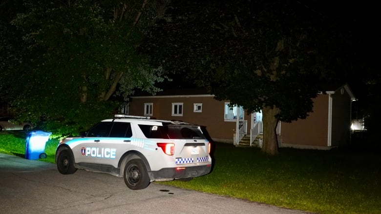 police car in front of home