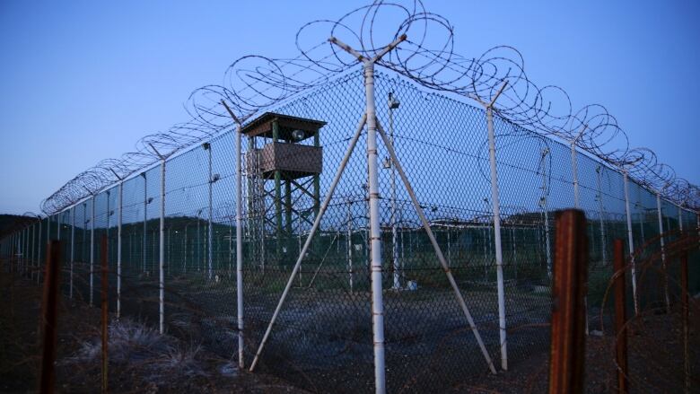 A section of wire-topped fence is seen at the U.S. Naval Base in Guantanamo Bay, Cuba, in a file photo taken on March 21, 2016.