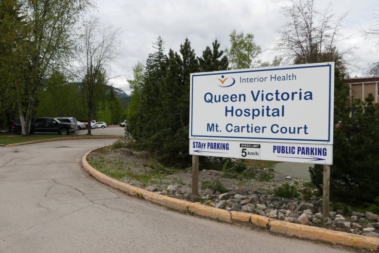 A sign reads 'Interior Health Queen Victoria Hospital Mt. Cartier Court'.