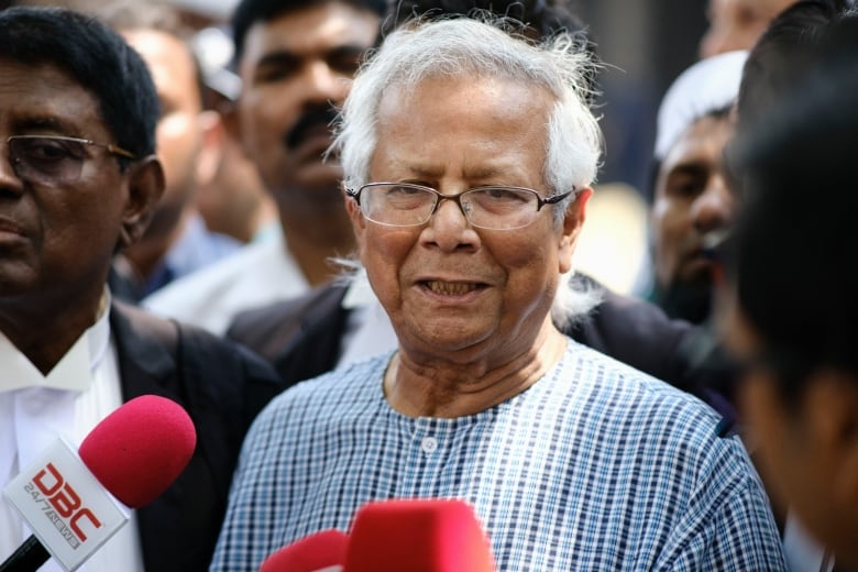 A man speaks to reporters.