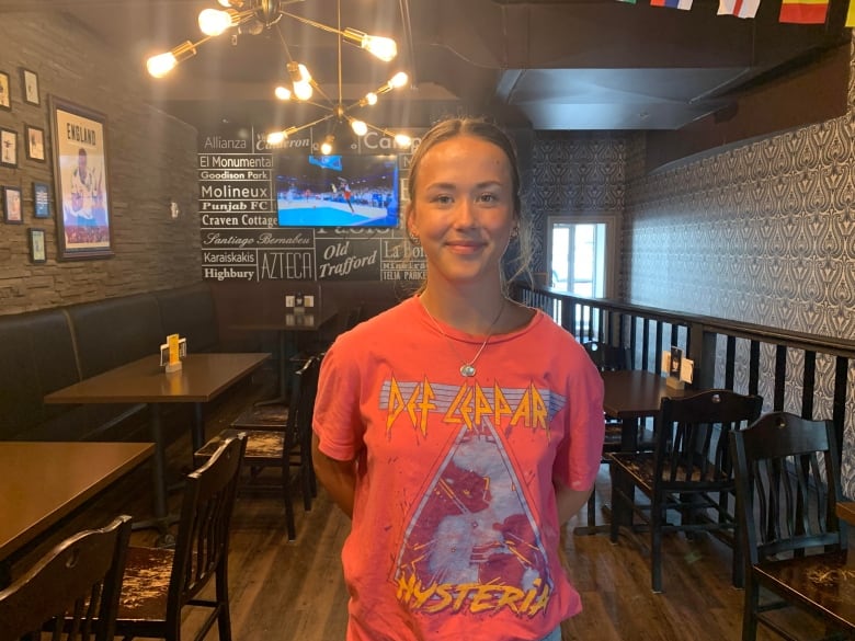 A woman standing in a restaurant 