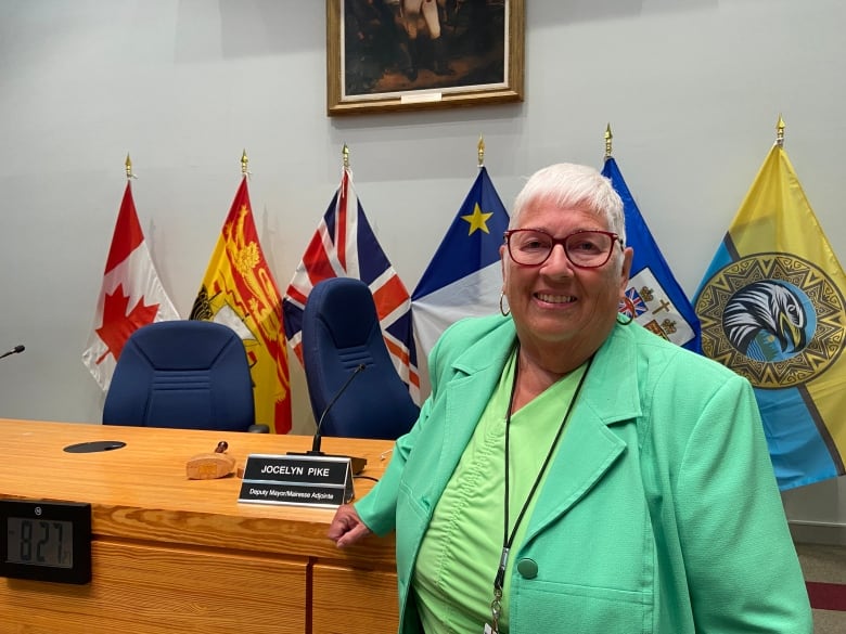 Jocelyn Pike stands in Fredericton council chambers.